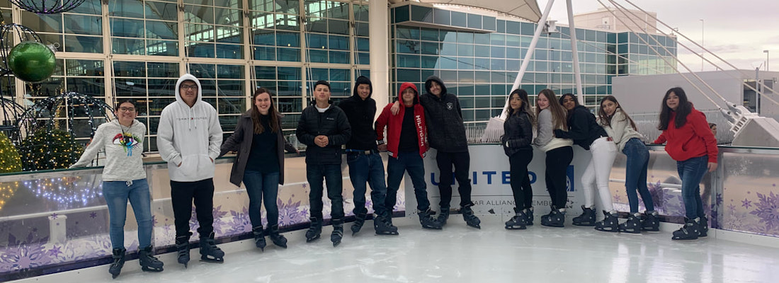 Group of students posing on ice rink